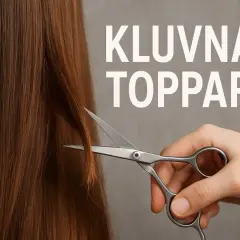 En hand klipper av kluvna toppar på slitet hår.