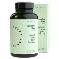 En flaska och en kartong med "Beautiful Hair" hår vitaminer. Stöd ditt goda hår-dag med dessa veganska kosttillskott.