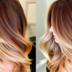Vackert balayage ljust hår med varma toner som övergår från mörkare brunt till blonda slingor.